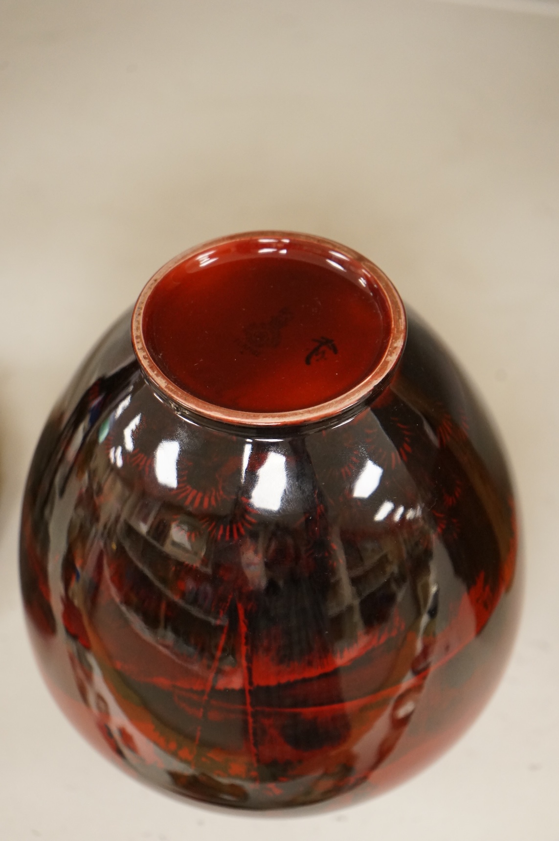 A Royal Doulton flambé vase decorated with a landscape, 19cm high